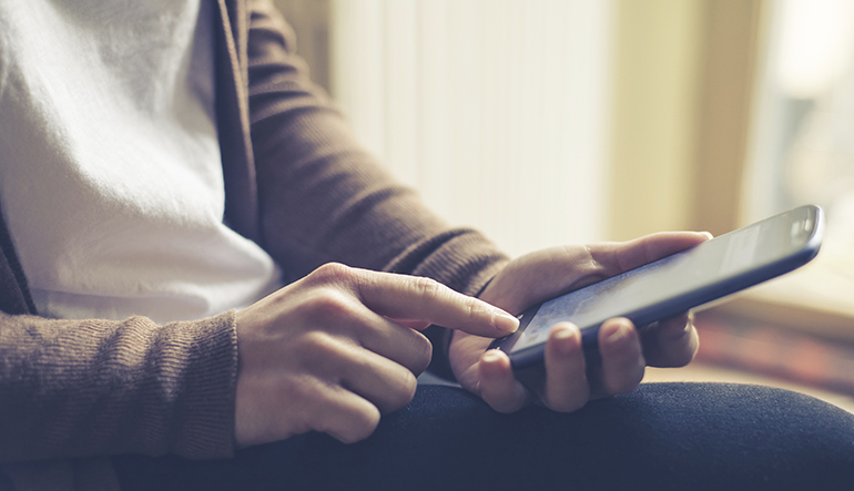 close up of hand woman typing on smart phone