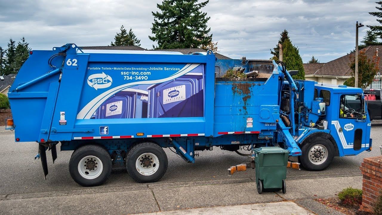 Sanitary Service Company Truck Collecting Waste